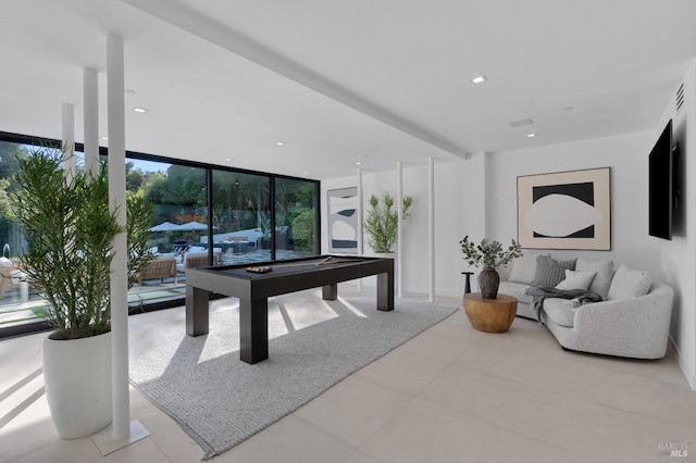 game room featuring floor to ceiling windows and pool table