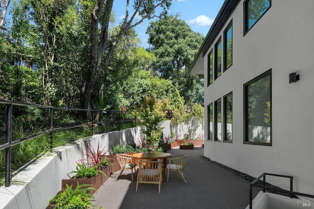 view of patio with a fenced backyard and outdoor dining space