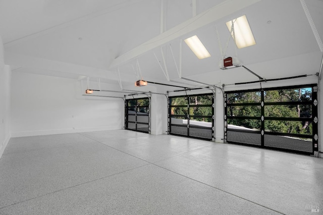 garage featuring baseboards and a garage door opener