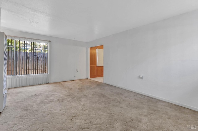 empty room featuring light carpet