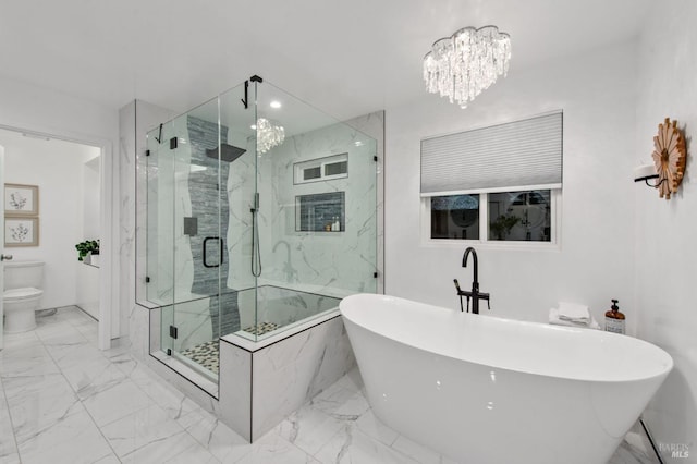 bathroom featuring a notable chandelier, shower with separate bathtub, and toilet