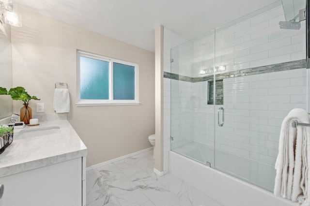 full bathroom featuring enclosed tub / shower combo, vanity, and toilet