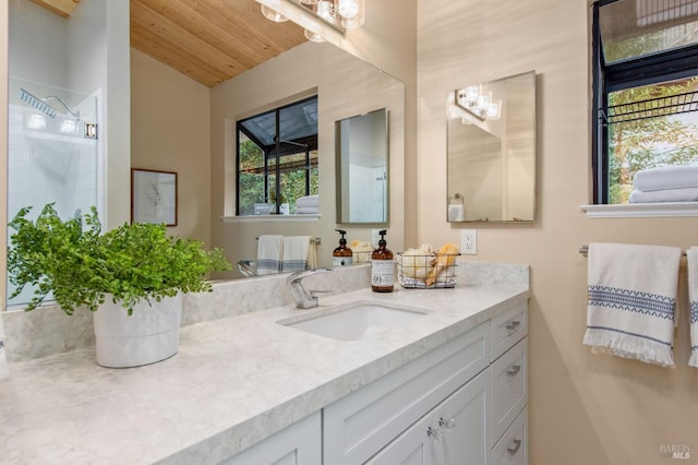 bathroom featuring vanity, a shower, and wood ceiling