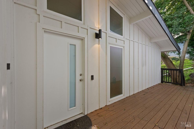 property entrance with a wooden deck