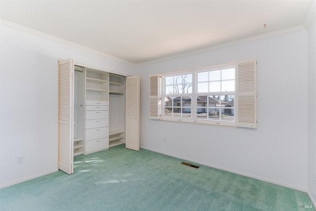 unfurnished bedroom featuring crown molding, a closet, light colored carpet, visible vents, and baseboards