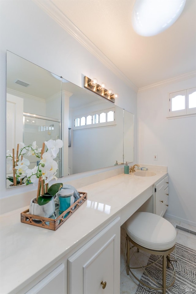 full bath with visible vents, crown molding, a shower stall, and double vanity