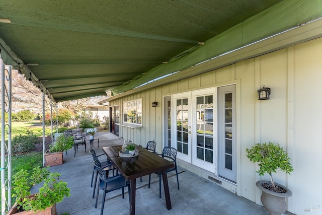 view of patio featuring outdoor dining space and french doors