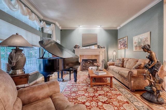 living room with a tiled fireplace and ornamental molding