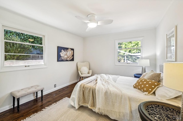 bedroom with ceiling fan and dark wood-type flooring