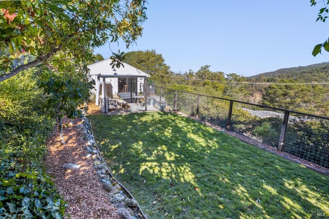 view of yard featuring a gazebo, a mountain view, and a patio