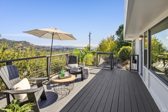 wooden terrace featuring a mountain view