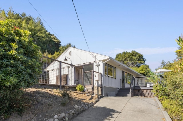 bungalow featuring a deck