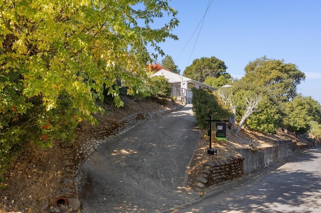 view of property hidden behind natural elements