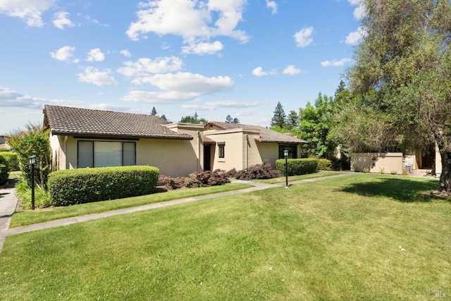 view of front of home with a front lawn