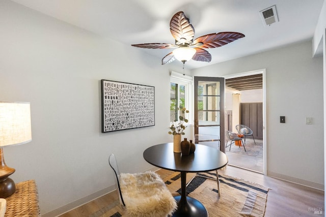 dining area with ceiling fan and light hardwood / wood-style floors