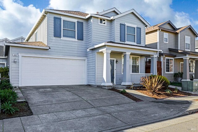 view of front of house with a garage and a porch