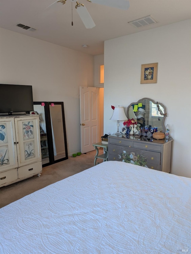 bedroom with ceiling fan and carpet floors