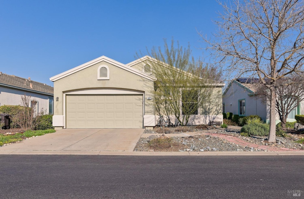 ranch-style house featuring a garage