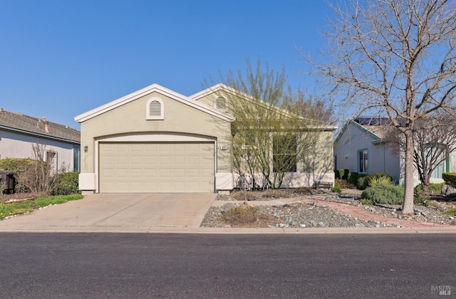 ranch-style house featuring a garage