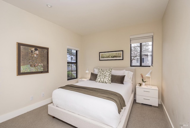 carpeted bedroom with baseboards