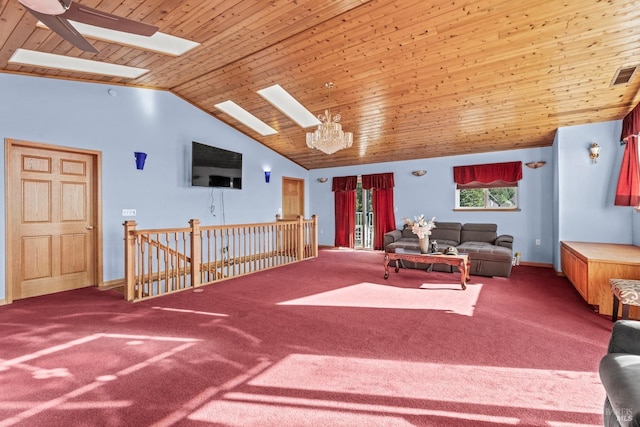 carpeted living room featuring high vaulted ceiling, a skylight, wood ceiling, and a chandelier