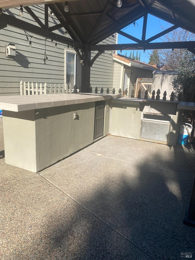 view of patio featuring a gazebo and an outdoor kitchen