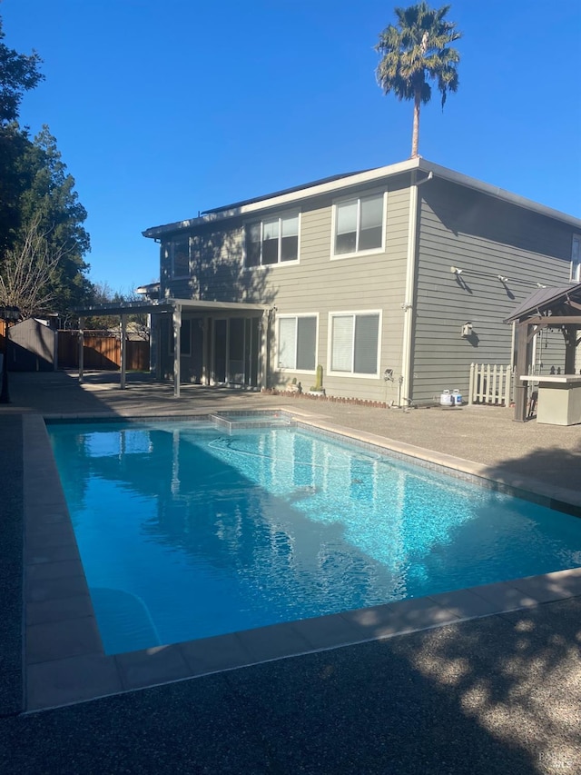 view of swimming pool featuring a patio area and a gazebo