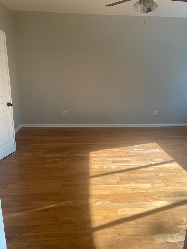 spare room with ceiling fan and light hardwood / wood-style floors