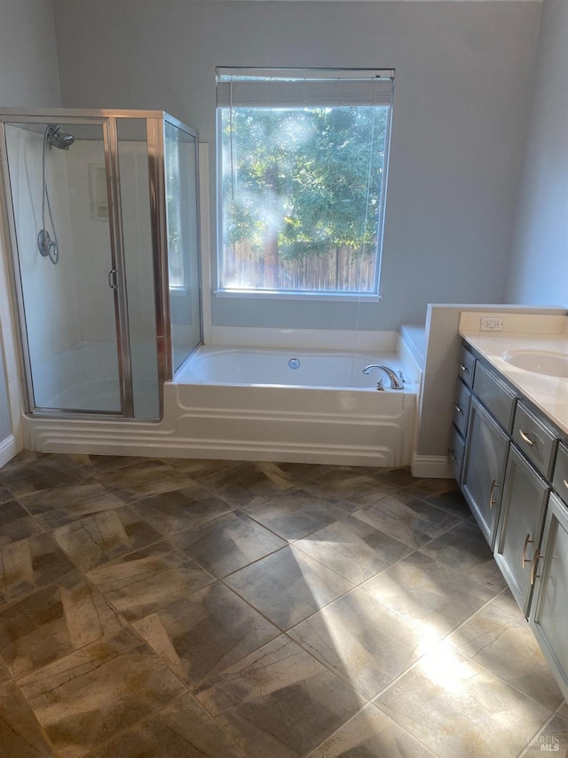 bathroom with plus walk in shower and vanity