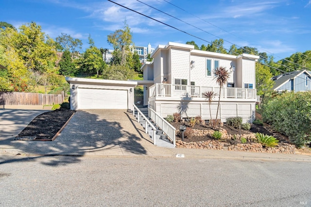 view of front of property featuring a garage and a porch