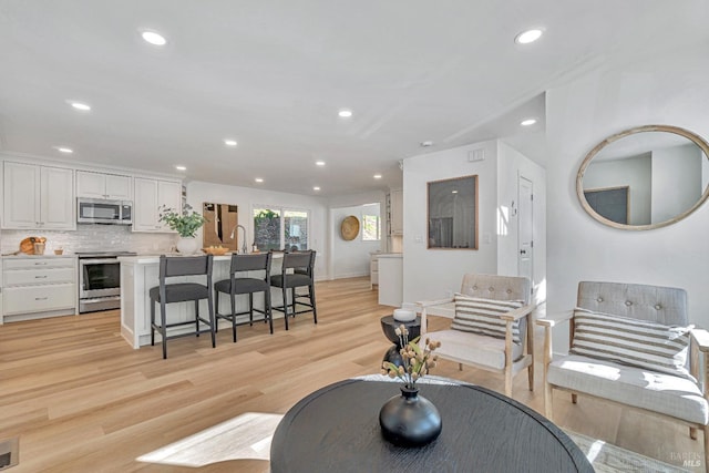 living room with light hardwood / wood-style floors