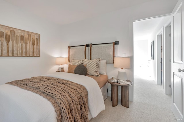 bedroom featuring light colored carpet