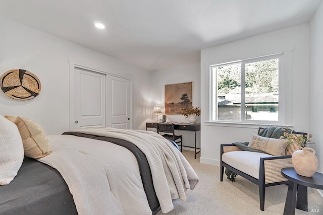 carpeted bedroom featuring a closet