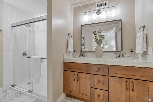 bathroom featuring walk in shower and vanity