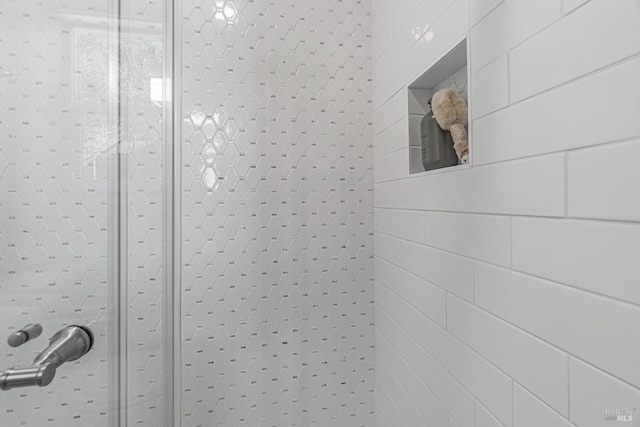 room details featuring a shower with shower door