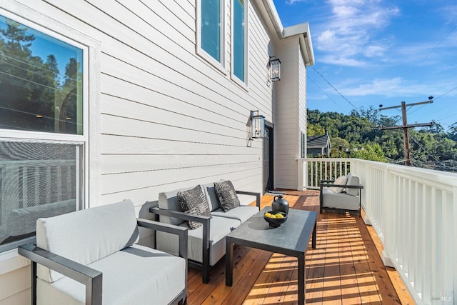 wooden terrace with outdoor lounge area