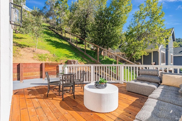 wooden terrace with outdoor lounge area