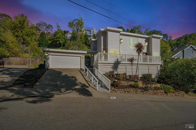 view of front of property featuring a garage and covered porch