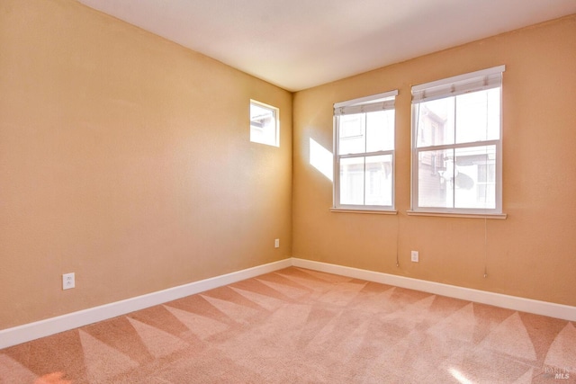 unfurnished room with carpet flooring