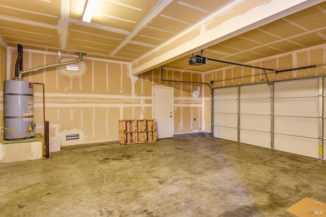 garage featuring water heater and a garage door opener