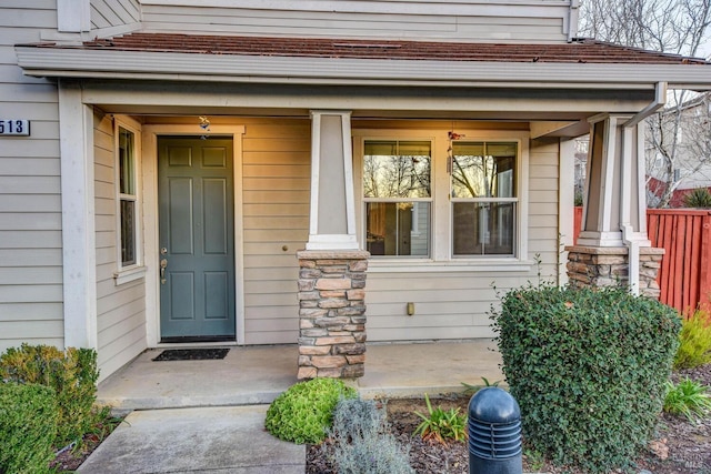 property entrance featuring a porch