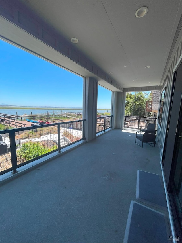 view of patio with a water view