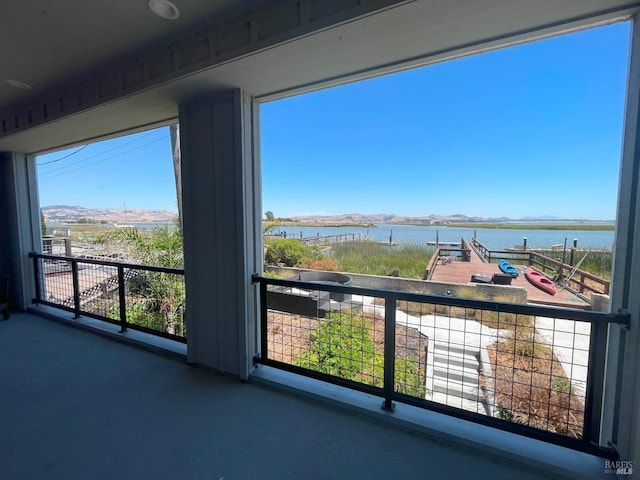 balcony featuring a water view