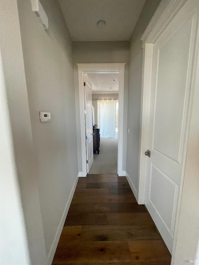 hallway featuring dark hardwood / wood-style flooring