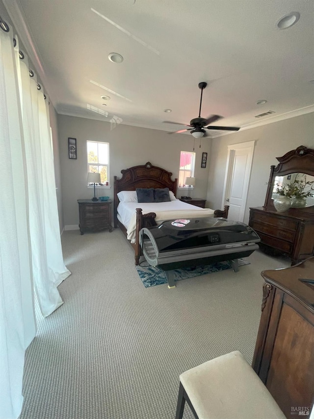 carpeted bedroom with ceiling fan, crown molding, and multiple windows