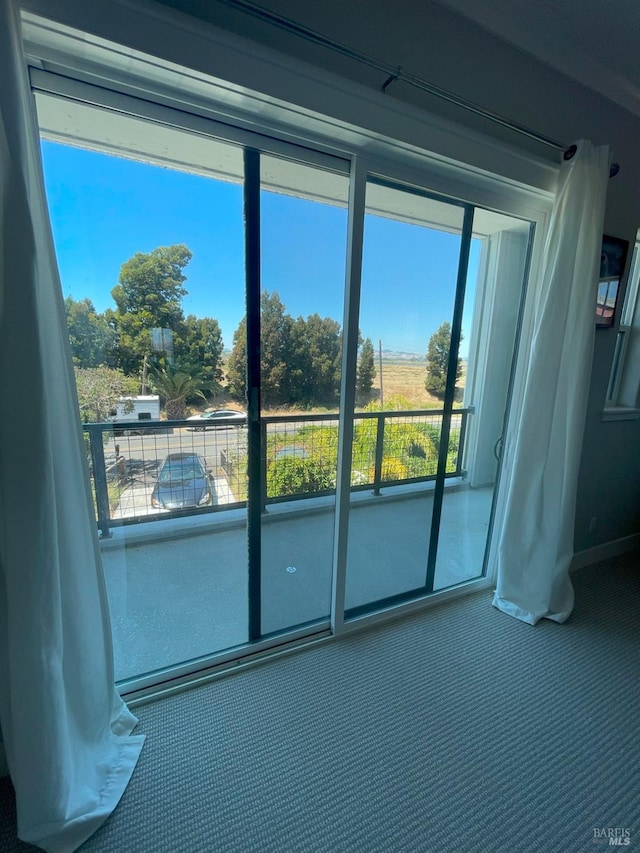 unfurnished room with a wealth of natural light and carpet floors