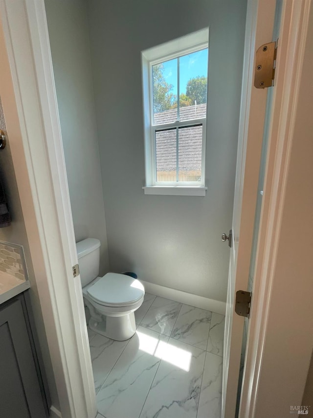 bathroom featuring toilet and vanity