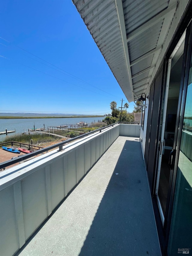 balcony featuring a water view