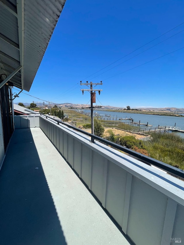 balcony featuring a water view