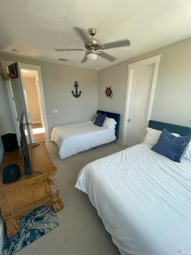 carpeted bedroom with ceiling fan